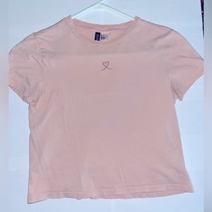 Womens semi cropped light pink embroidered shirt.